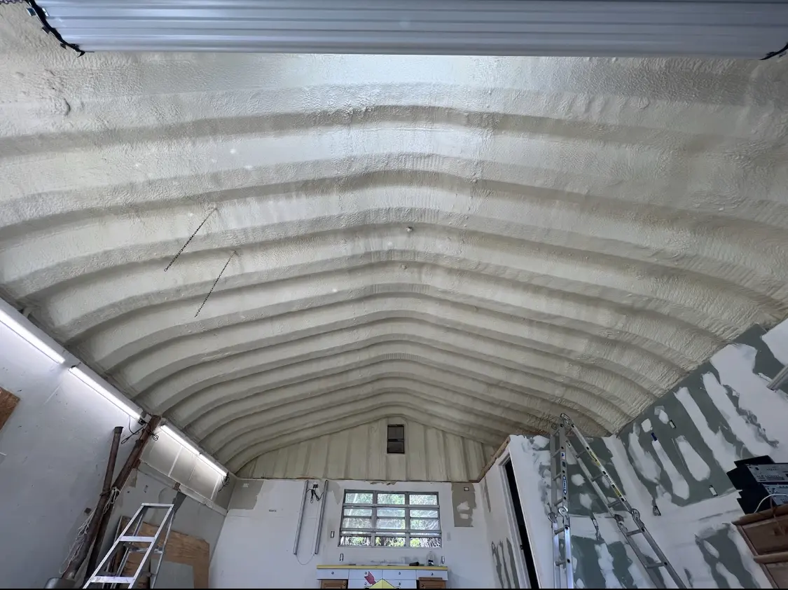 Spray polyurethane foam applied to the underside of a metal roof deck in Severance